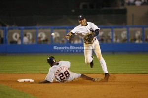 Across the bag, away from the runner, side arm throw.